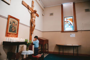 St Mary Star of the Sea Catholic Primary School Hurstville student praying inside church