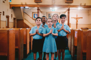 St Mary Star of the Sea Catholic Primary School Hurstville students praying inside church
