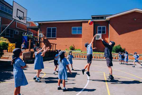 Students playing basketball at St Mary Star of the Sea Catholic Primary School Hurstville